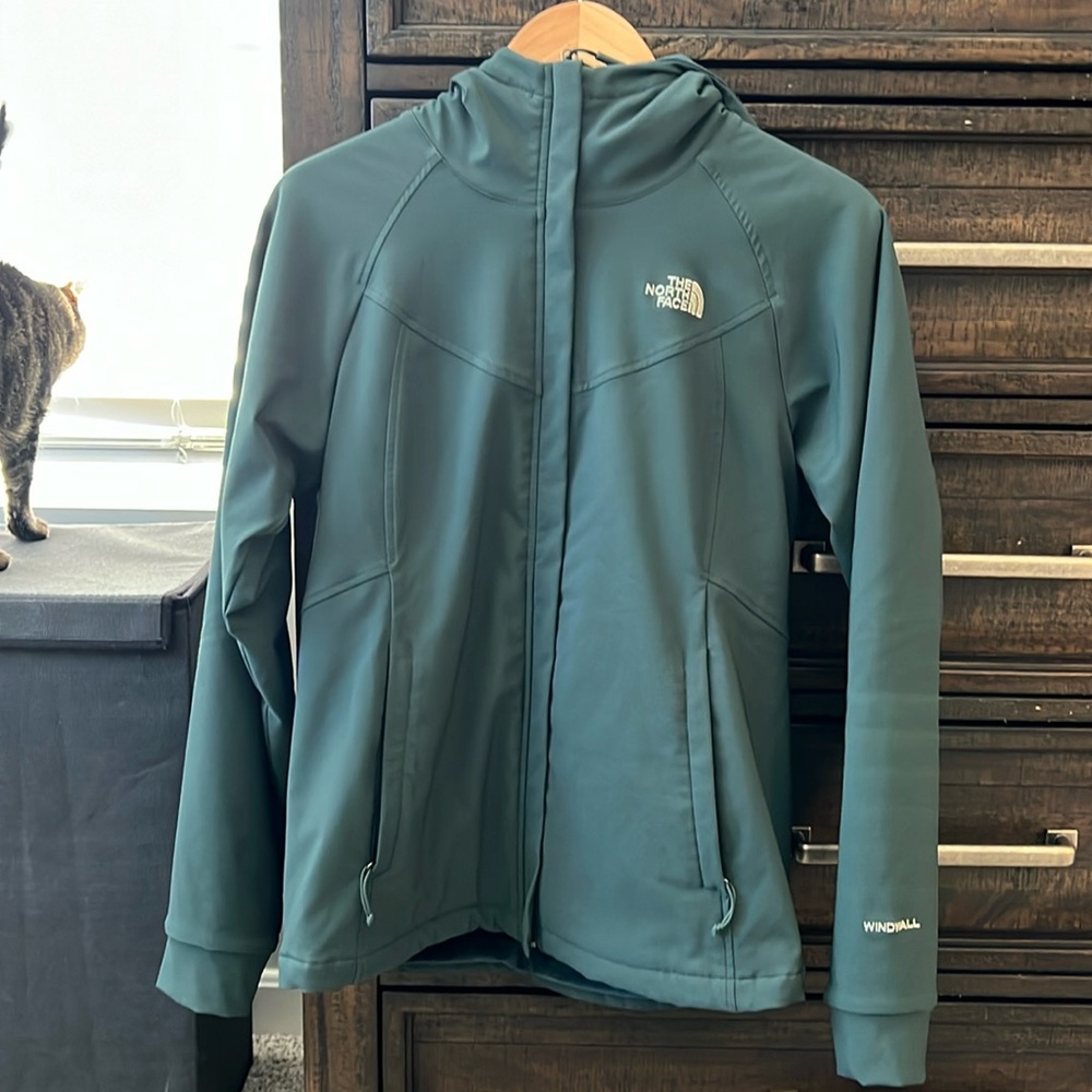 The North Face hunter green, fleece lined hooded coat.